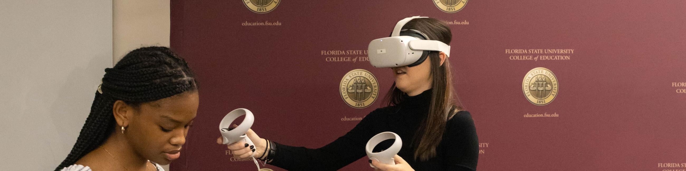 Two females testing out new technologies. 
