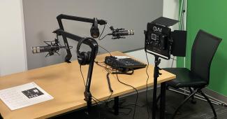 The microphone and green screen set up can be used for product promotions, podcast recordings and more.