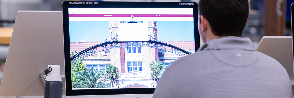 Student looking at FSU sign in screen on desktop computer