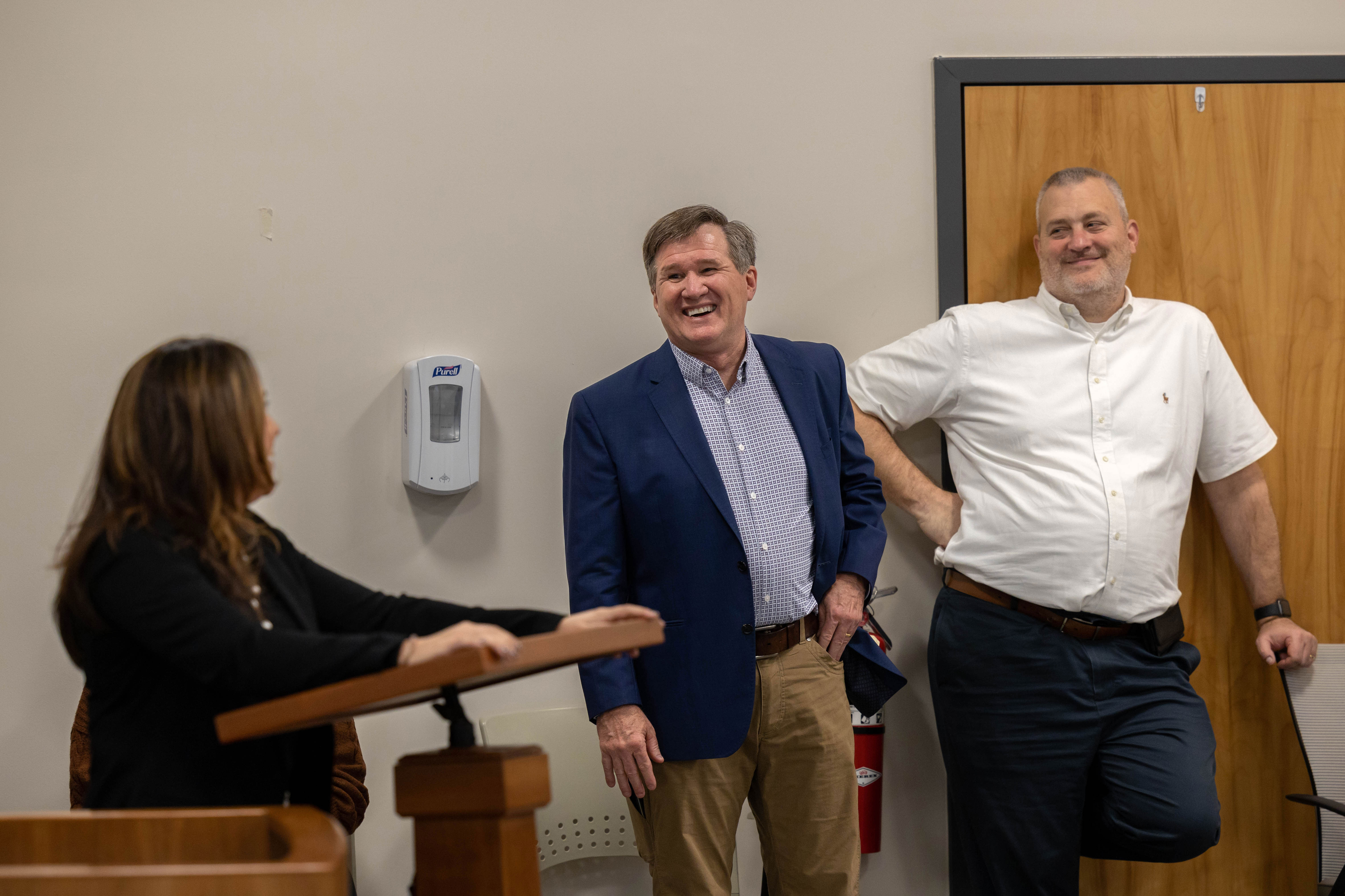 Three coworkers talking to each other