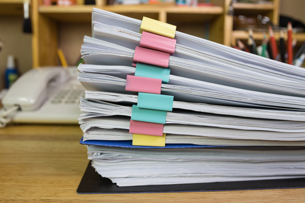 Stack of paper documents.