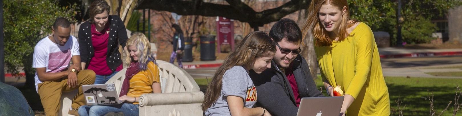 Students sitting around Landis fountain